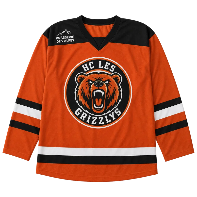 Maillot de hockey personnalisé orange et noir, écusson ours du club et sponsor